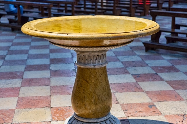 Could be the baptismal font but my guess is that it the Stoups that contains the holy water