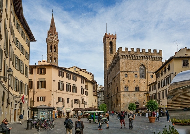 The piazza with the tower of  Badia Fiorentina and Monastero on the left