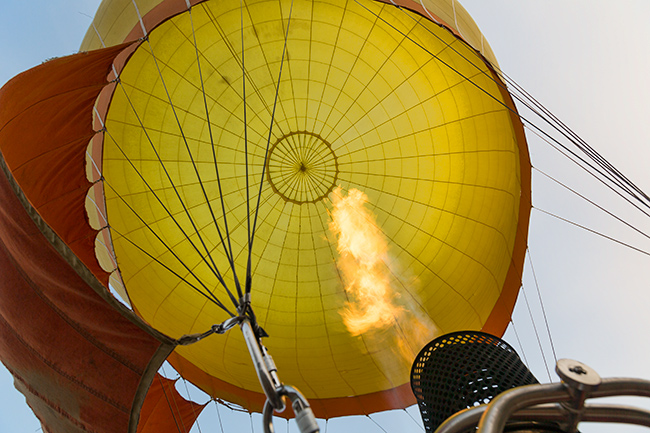 Blasting hot air into the hot air balloon