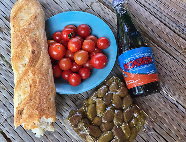 Greek olives and olive oil with Thai tomatoes and French bread